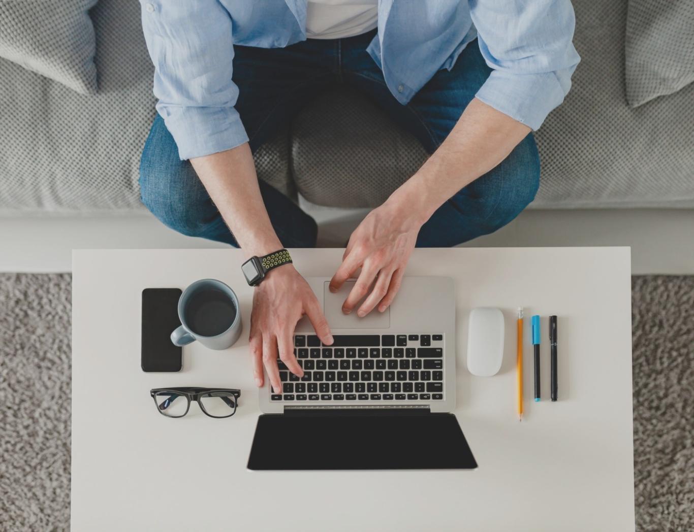 Student working on budget planning with laptop and financial documents